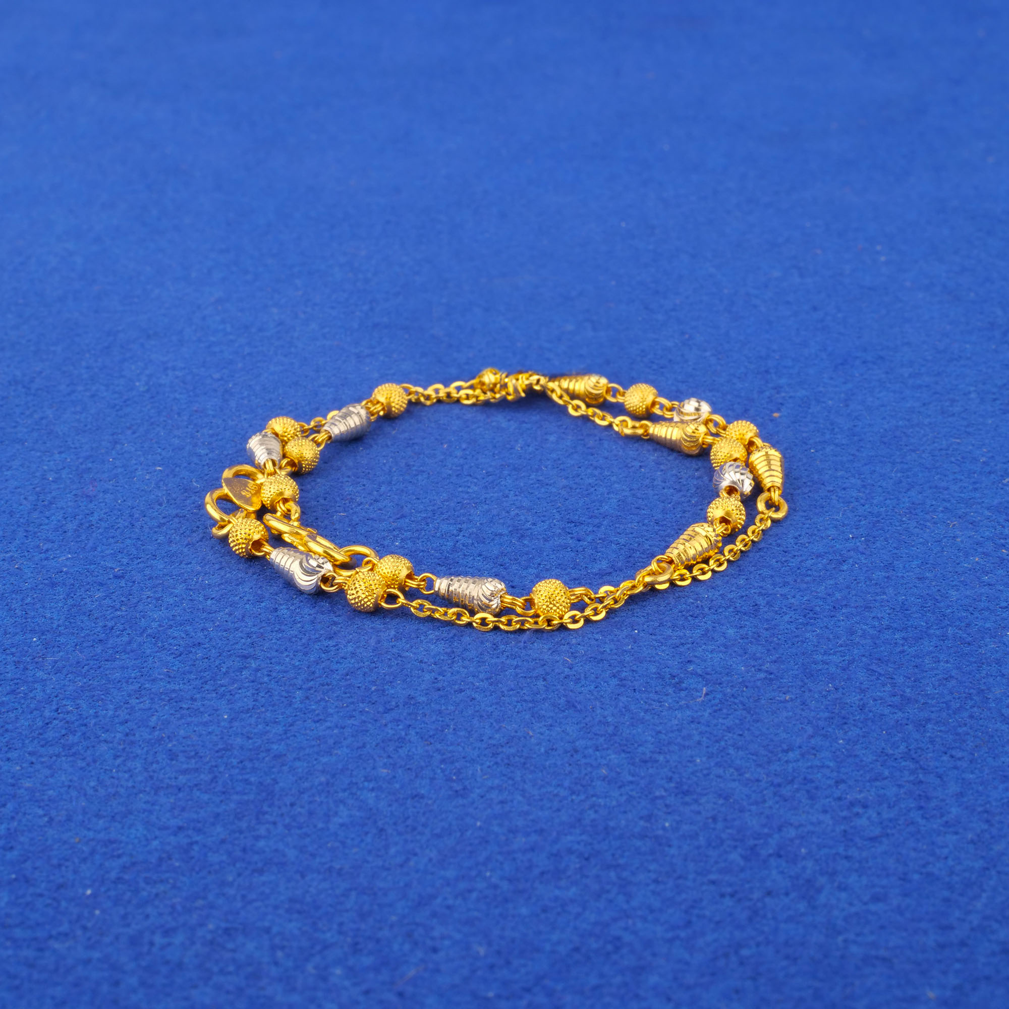 Twenty-Two Karat Baby Two-Tone Gold Bracelets Pair