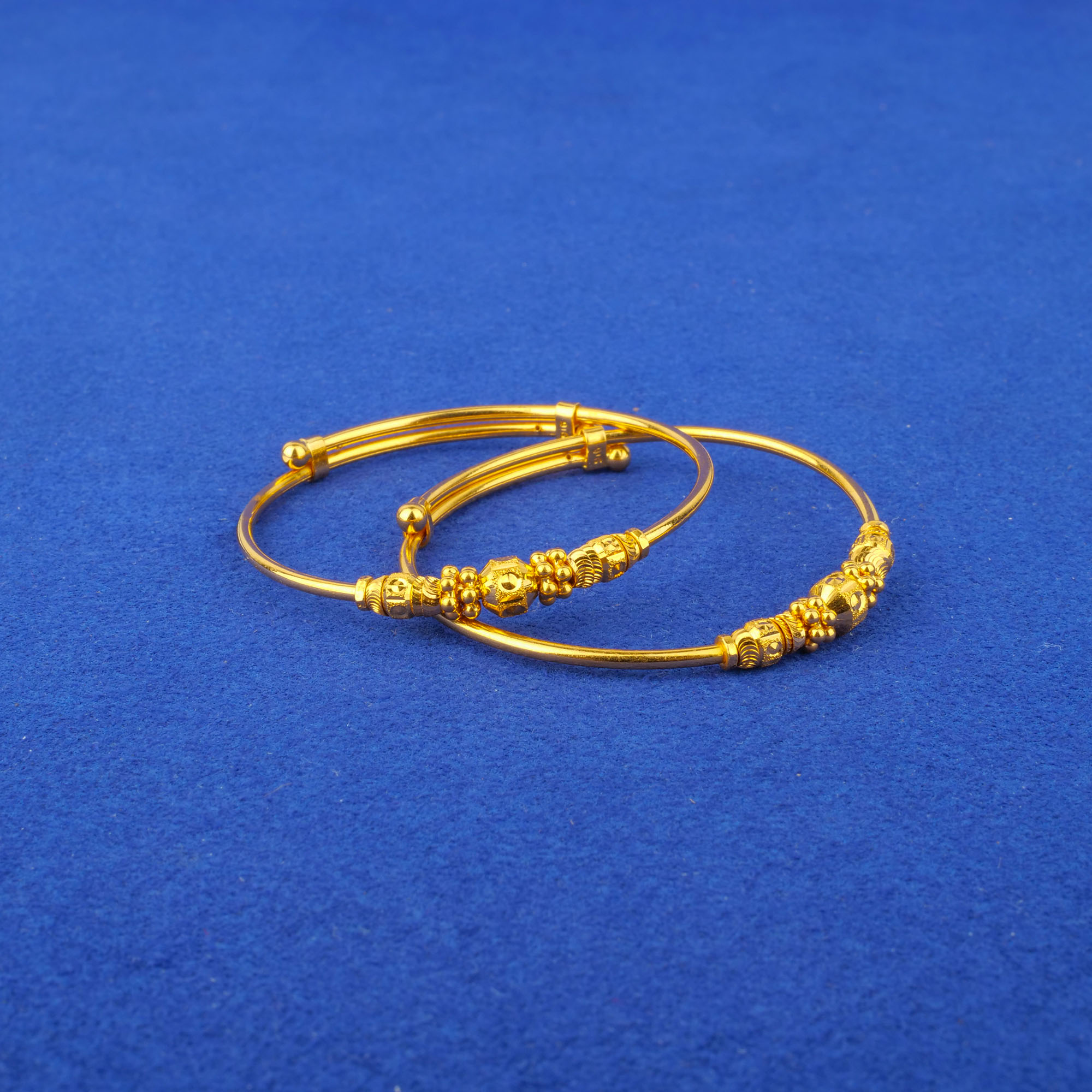 Twenty-Two Karat Baby Gold 'Adjustable' Bangles