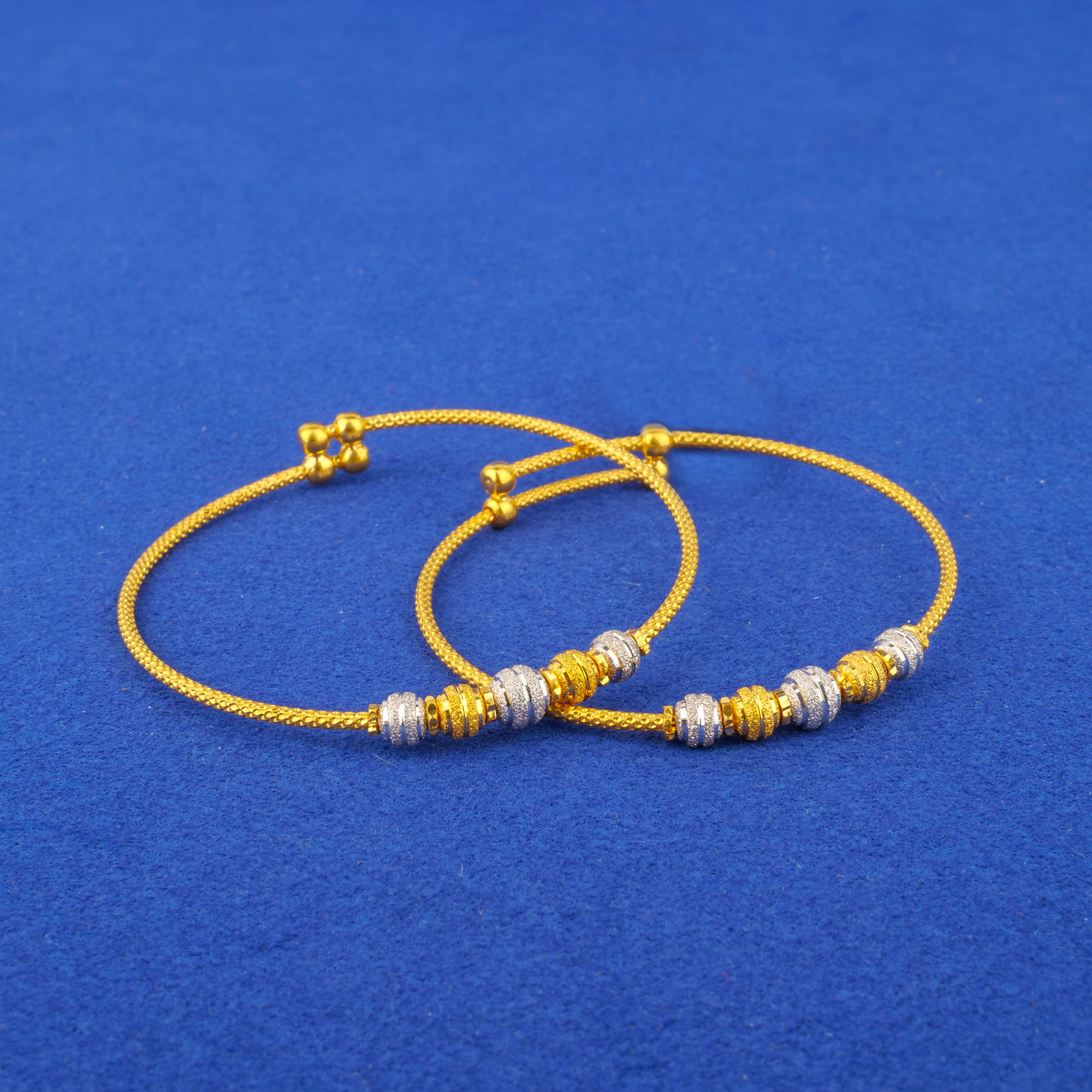 Twenty-Two Karat Baby Two-Tone Gold 'Adjustable' Bangles