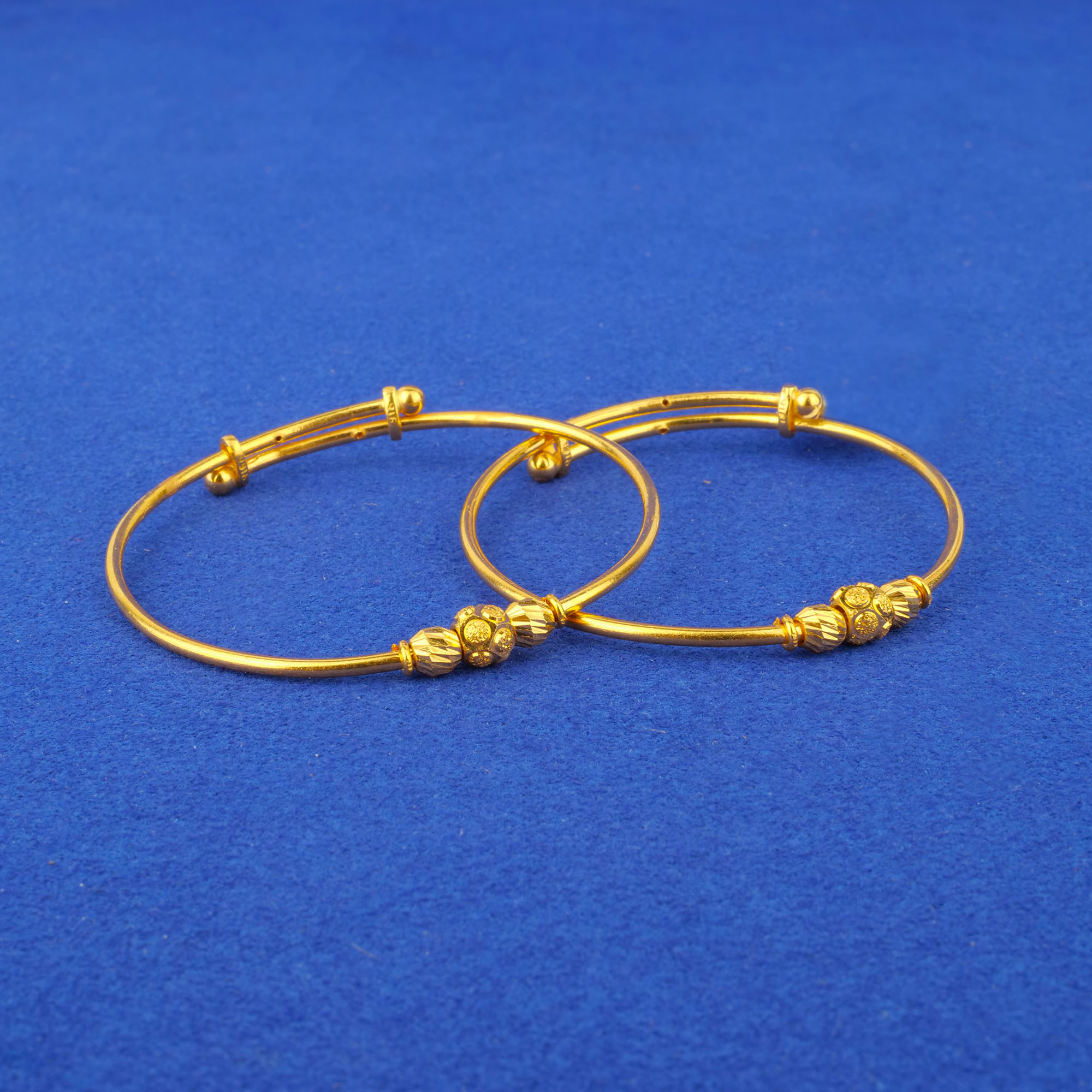 Twenty-Two Karat Baby Gold 'Adjustable' Bangles