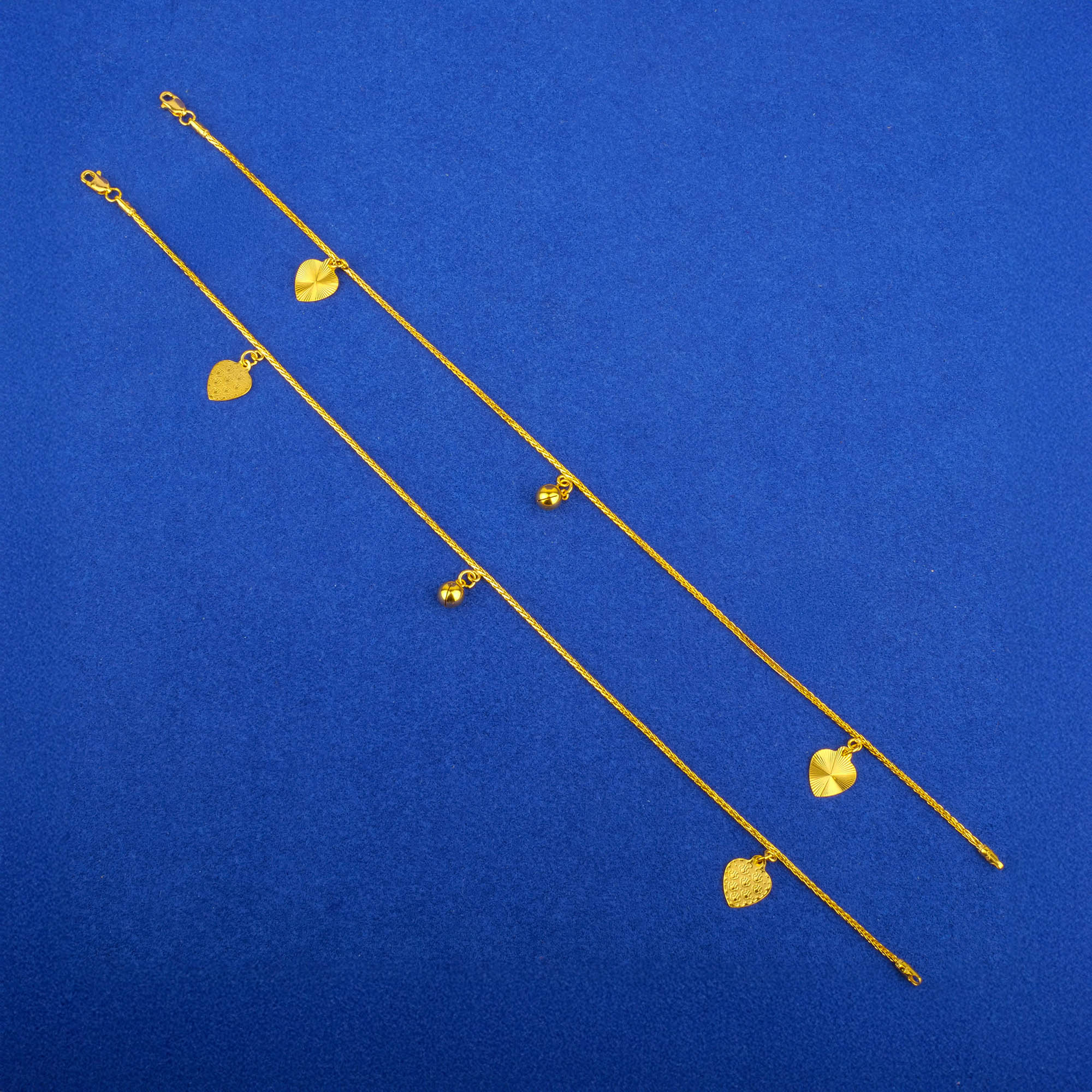 Twenty-Two Karat Gold 'Charm' Anklets (Pair)