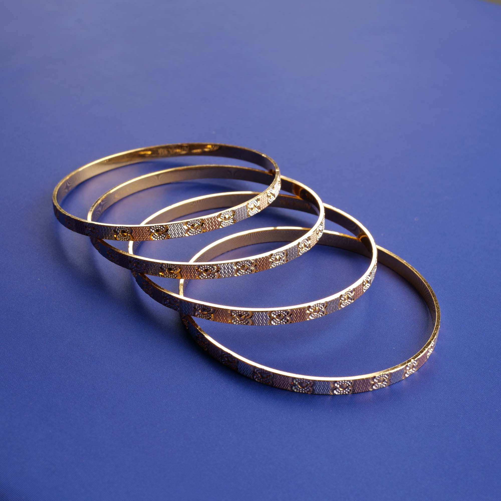 Sunlit Serenade: Two-Tone Gold Bangles