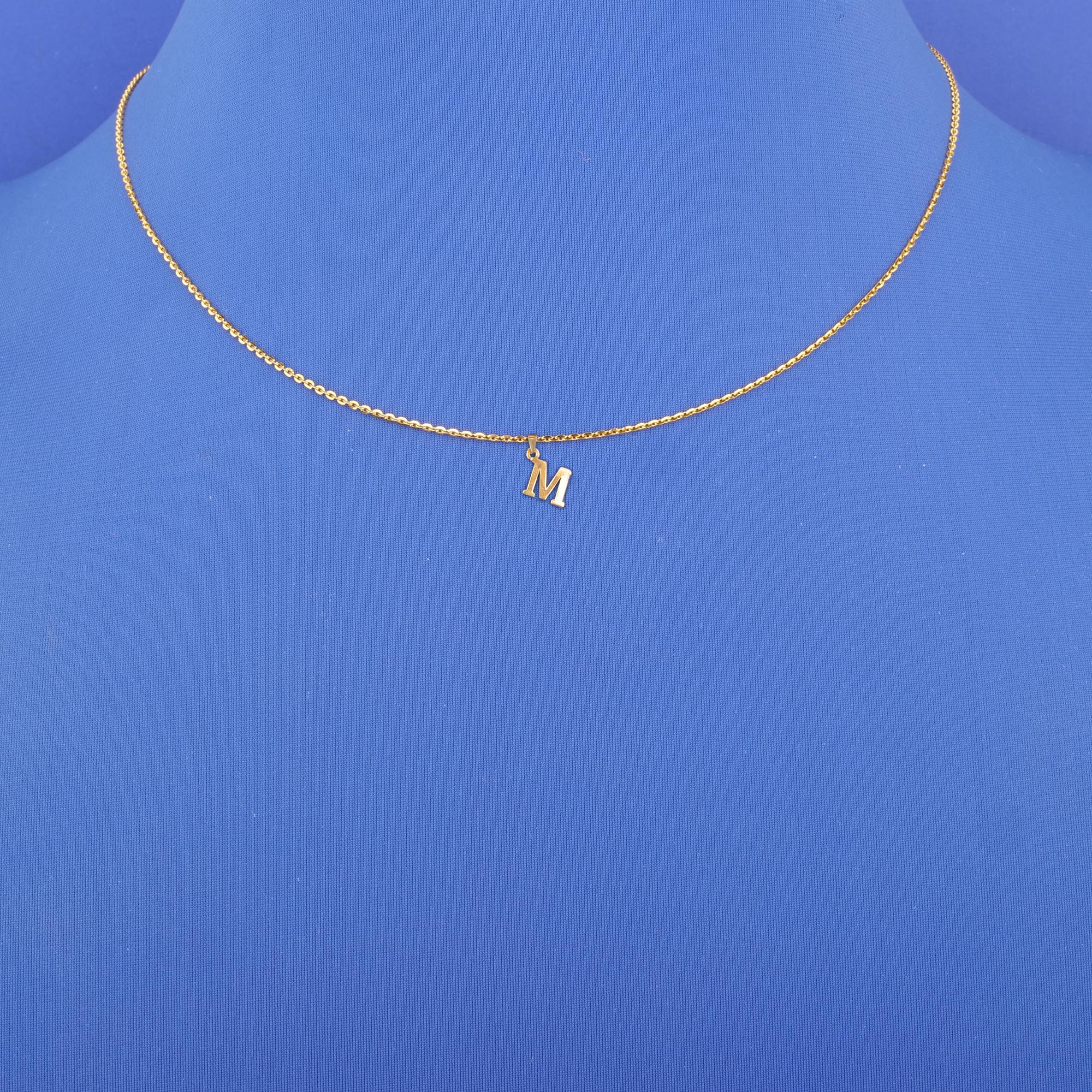 Twenty-Two Karat Gold Initial 'M' Pendant (chain not included)