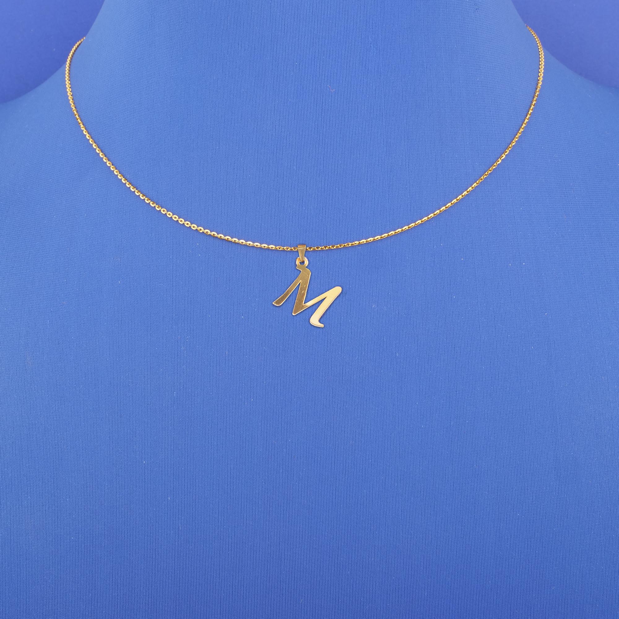 Twenty-Two Karat Gold Initial 'M' Pendant (chain not included)