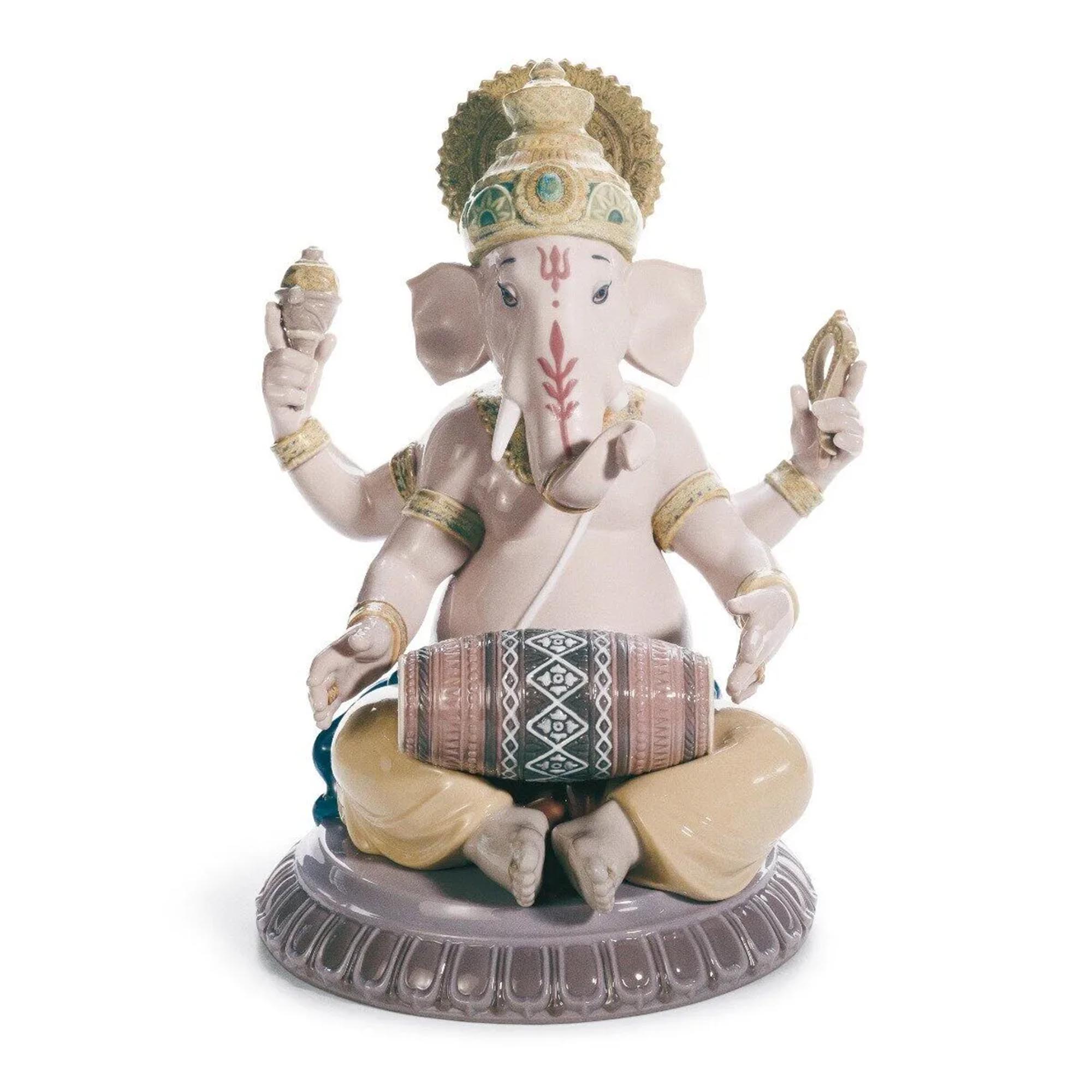 Mridangam Ganesha Figurine Porcelain figurine of the Hindu god Lord Ganesha, with a human body and the head of an elephant, playing the mridangam, a traditional instrument.