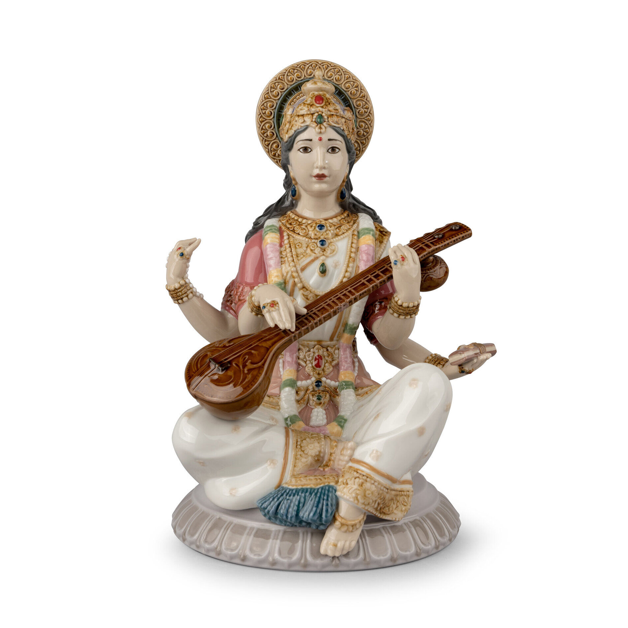 Goddess Saraswati Figurine.The story goes that Saraswati was so beautiful that her husband Brahma had four heads so that he could see her from any direction.