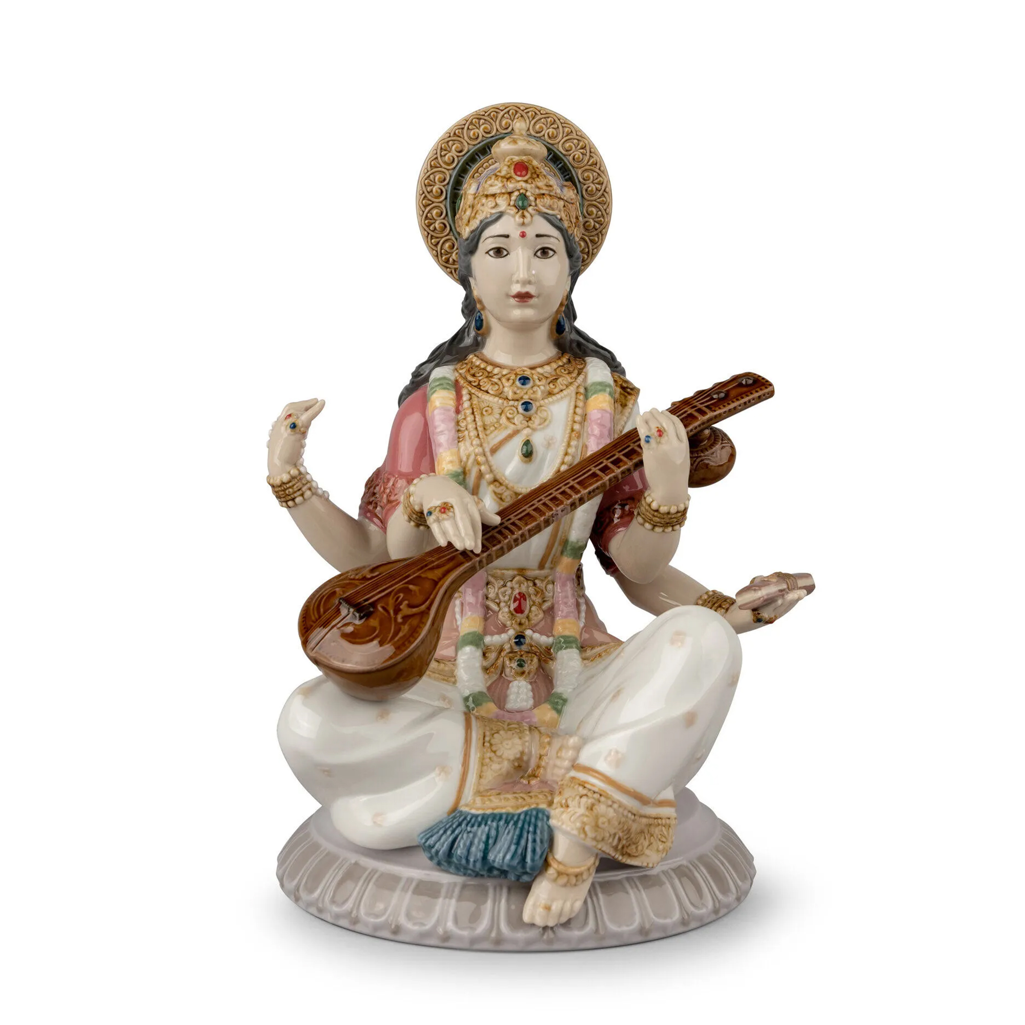 Goddess Saraswati Figurine. The story goes that Saraswati was so beautiful that her husband Brahma had four heads so that he could see her from any direction.