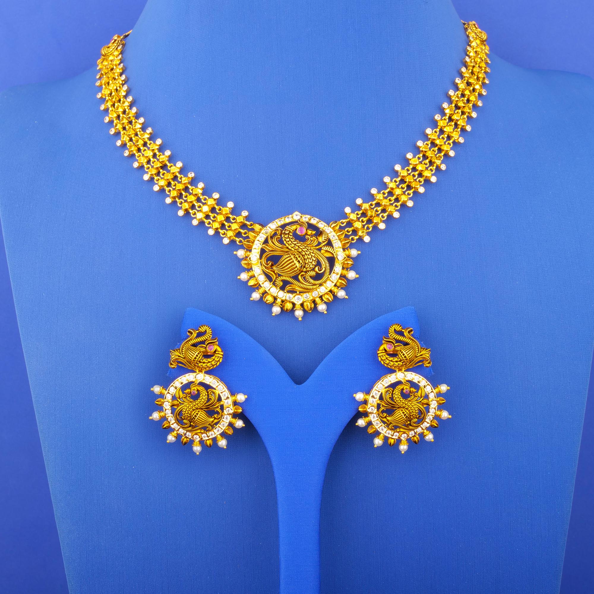 Twenty-Two Karat 'Antique' Ruby Cubic Zirconia Pearl Necklace and Earrings Set
